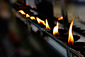 oil lamps in a temple by Mohamed Nuzrath -  