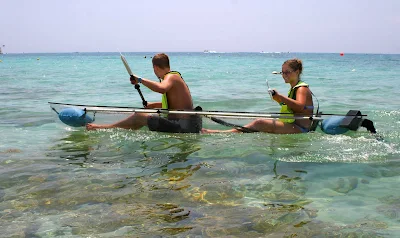 Clear kayaks, available for rent at Cozumel beaches, let visitors pilot their own glass-bottom boat over reefs.