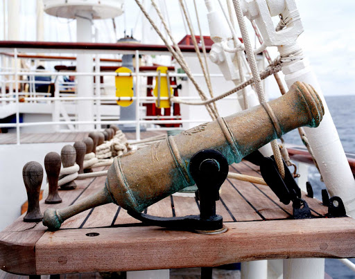  Star Clipper showcases a ceremonial brass cannon on its deck.