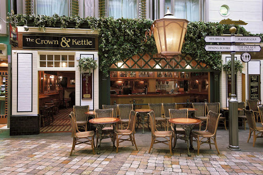 Have a pint and a game of darts at the Crown & Kettle, a traditional English-style pub on Explorer of the Seas.
