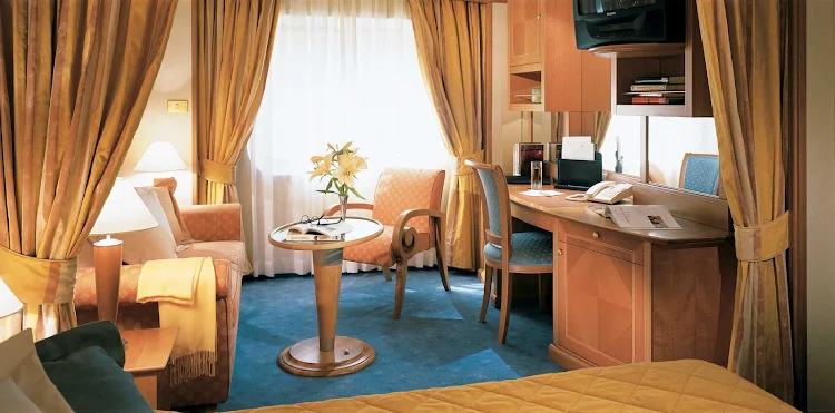 Silversea's Vista Suite offers a sitting area with plenty of space for relaxing and a writing desk if the mood strikes you.