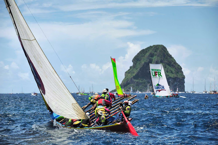 A Yole or "gig," meaning an elongated boat, is featured in a festive regatta during Martinique's traditional island Carnival.