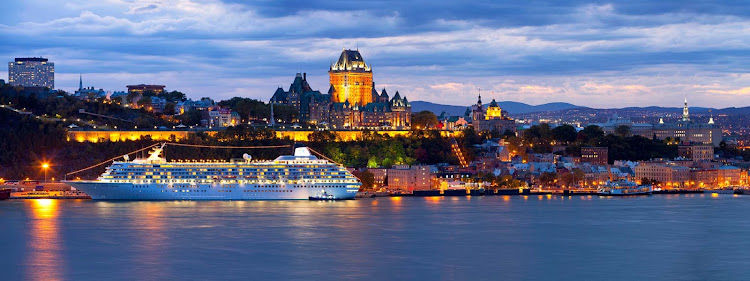 Crystal Symphony sails through the evening glow of Quebec, Canada.