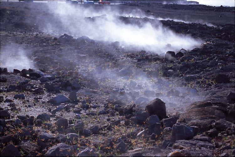 Vapor rises along the trail at Halemaumau Crater, an active volcano on the Big Island of Hawaii. 