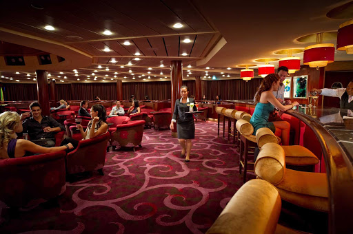 Inside Celebrity Constellation's refined Rendezous Bar.