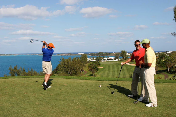 Driving the ball on Tucker's Point Golf Course, Bermuda.