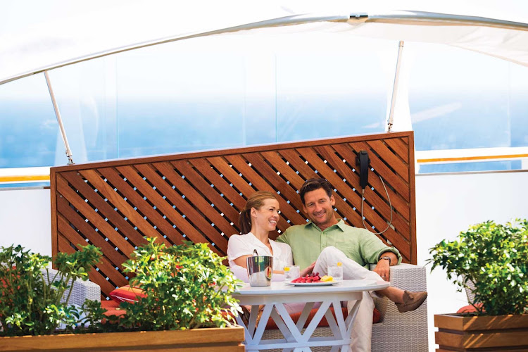 Sit on the Celebrity Reflection's deck and people watch or take in a game of lawn bowls with a fruit platter and a refreshment.