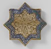 Star-shaped tile with floral scrolls