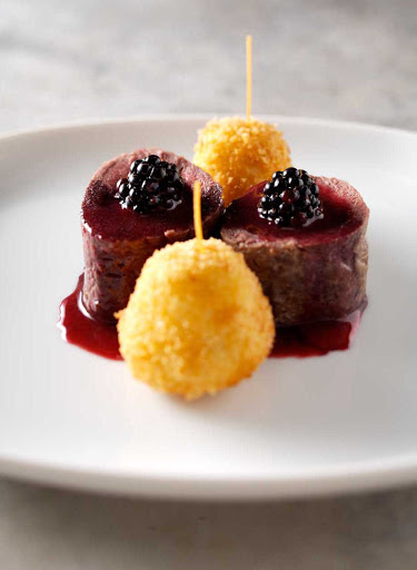 Cunard-venison-sausage-blackberry-coulis - A venison sausage with blackberry coulis, straight from the kitchen of your Cunard cruise ship. 