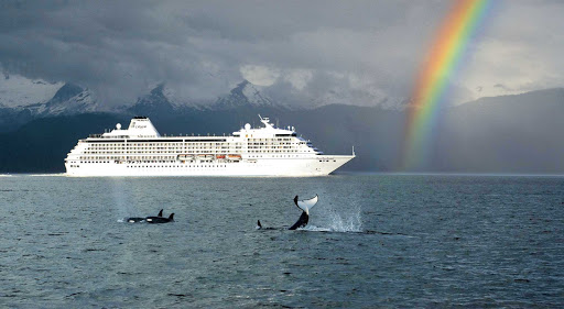 Regent-Seven-Seas-Mariner-Orcas-Rainbow - Even stormy weather can bring extraordinary sights, as Seven Seas Mariner travels through a rainbow while a pod of killer whales cavorts nearby.
