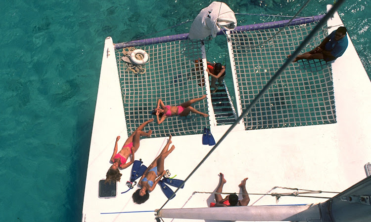 Cruising on a catamaran in the waters of Aruba.