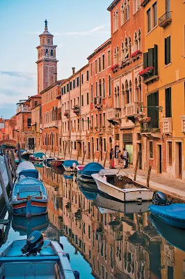 A painterly scene of Venice at dusk. The City of Canals is one of the destinations on a Tere Moana cruise.