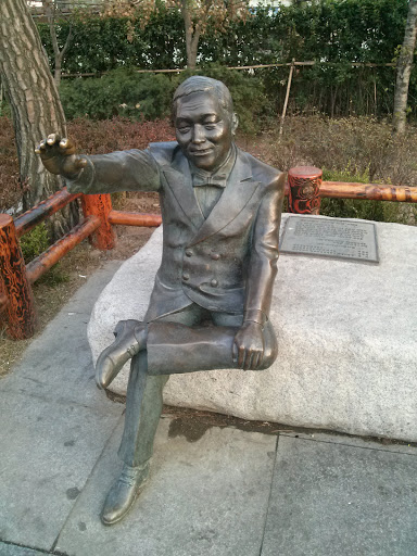 Statue of a Happy Man