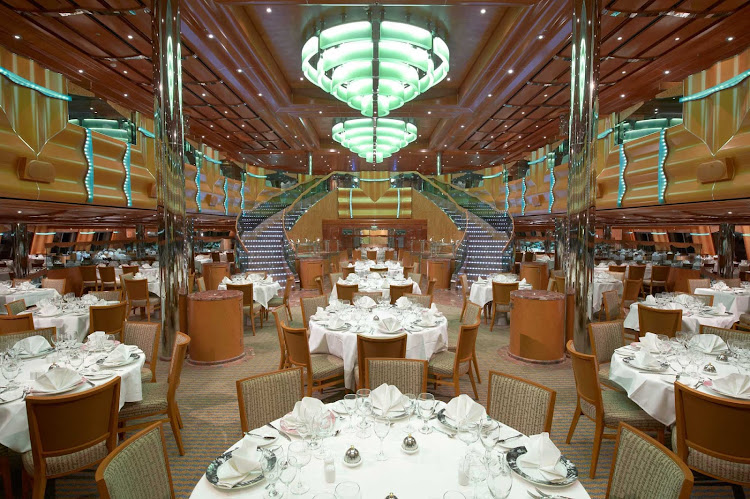 The two-level Northern Lights Restaurant, one of Carnival Magic's main dining halls, has formal (assigned) seating in the lower level, and the more flexible open-table option above.