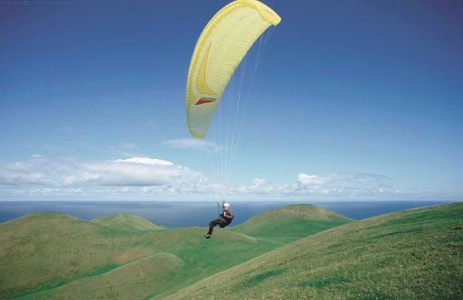 paragliding-Magdalen-Island-Quebec - YOLO, right? Take the adventure of a lifetime by paragliding over Iles-de-la-Madeleine (Magdalen Island) in in the Gulf of Saint Lawrence, Canada.