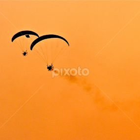 Paratroopers silhouetted against the sky at dawn by Nashira Usef - News & Events World Events