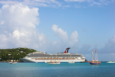 Smaller ships in the Caribbean stop by to check out Carnival Valor.
