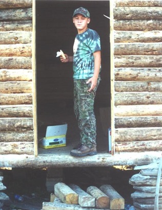 Building the cabin - Tyler in door
