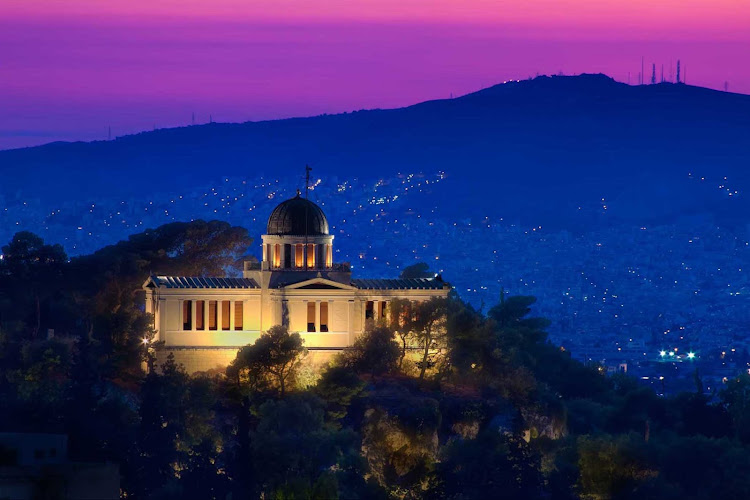 The National Observatory and surrounding hillsides at twilight in Athens, Greece.