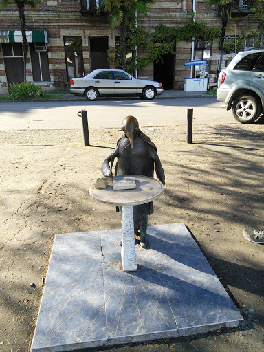 Reading Penguin Statue