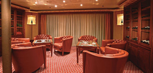 On Silver Cloud, the Connoisseur's Corner lets you unwind with a winning Cognac or a fine cigar. (You, too, ladies!)