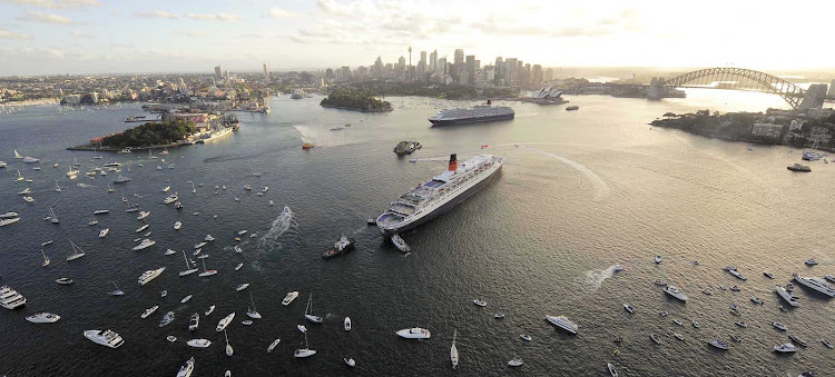 Queen Victoria and Queen Mary 2 have a royal rendezous as other vessels join in the celebration in Sydney Harbour.  Cunard is one of the leading cruise lines offering world cruises.