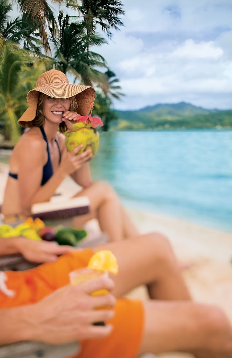 Sipping in the unspoiled beauty of Paul Gauguin's private beach on Motu Mahana.