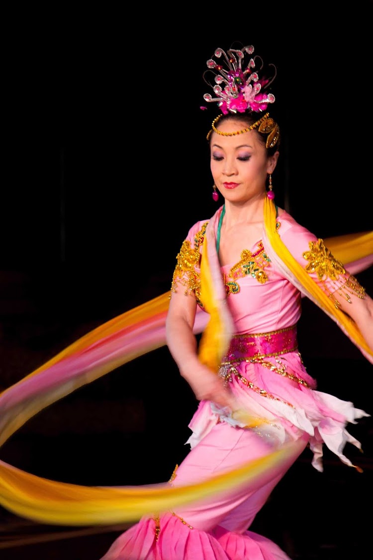 Be dazzled by the lovely ribbon dancers in the Hong Kong Folkloric Show aboard an Azamara cruise.