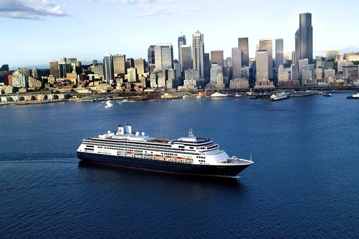 Holland-America-Amsterdam-in-New-York - MS Amsterdam in New York Harbor. The Holland America ship offers a diverse set of itineraries, including Grand World Voyages, Grand Pacific and Far East Voyages and sailings to Panama, the Southern Caribbean and Incan Empires.