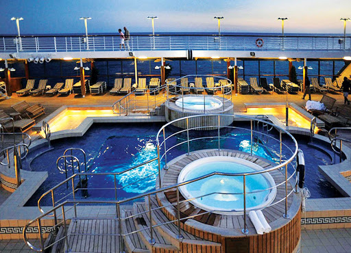 Oceania-RClass-pool-3 - Oceania Regatta's large heated pool and whirlpool spas are the ideal location to unwind and enjoy your travels.