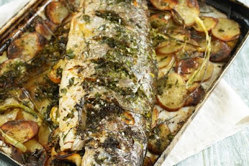 Whole roasted salmon stuffed with lemon and herbs
