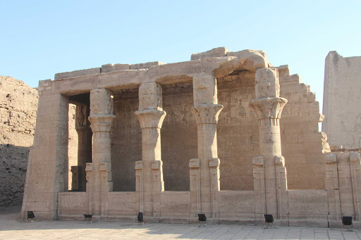 Edfu, Egypt, located on the west bank of the Nile. The town is known for the Temple of Horus, built from sandstone blocks between 237 BC and 57 BC, into the reign of Cleopatra VII, Wikipedia tells us. 