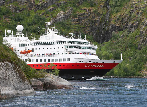Hurtigruten-Nordnorge-in-Norway - Hurtigruten's Nordnorge navigates its way through Einfahrt in den Trollfjord on a tour of Norway.