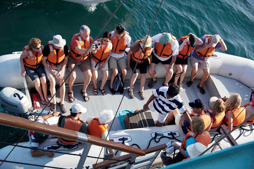 Windstar Cruises guests board a tender en route to a shore excursion in Playas del Coco, a youth-oriented beach community in Costa Rica.