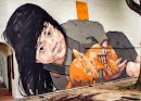 Girl Cuddling Cub Mural at Jln Pisang