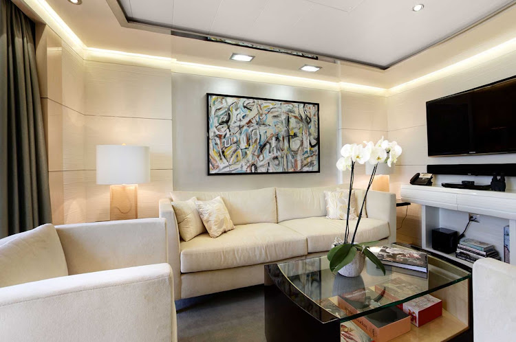 The classically designed Vista Suite lounge area aboard Oceania Riviera.