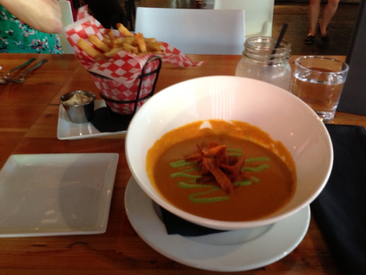 Spiced Carrot Bisque with Carrot Chips and Sweet Pea Creme Fraiche, and Duck Fat Frites