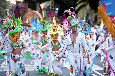 Ornately costumed dancers on parade at the Carnival of Santa Cruz de Tenerife in the Canary Islands. The festival is held in February each year and attracts visitors from around the world. 