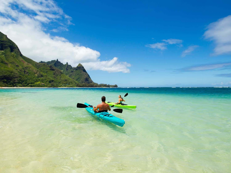 A couple kayaks at Makua Beach in Hanalei, Kauai. 