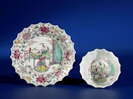 Bell-shaped cup and saucer with a man and woman on a terrace