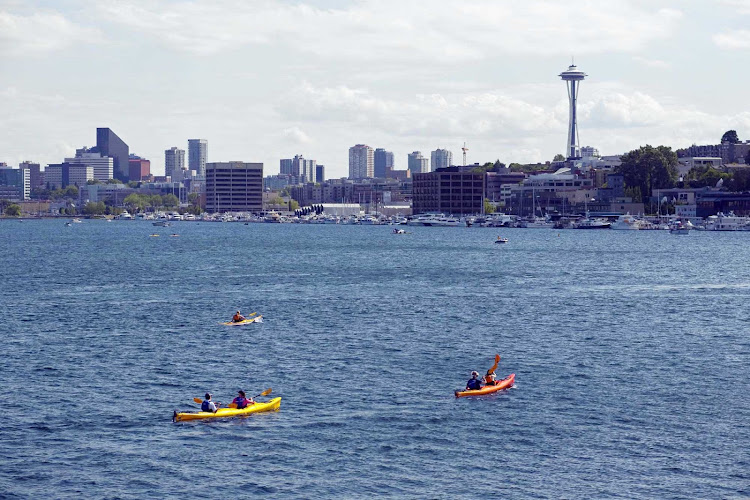 Kayakers enjoy a sunny day on the waters of Lake Union. 