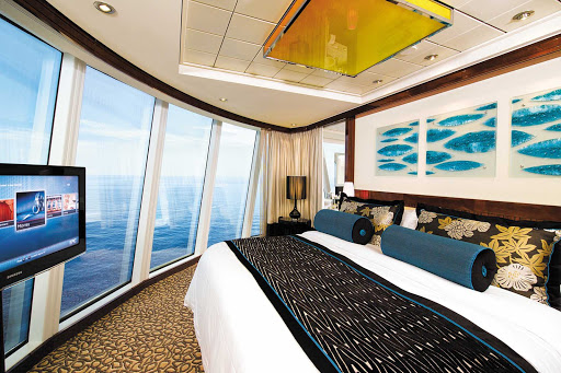 Norwegian Epic's Deluxe Owner's Suite can accommodate up to four guests. Floor-to-ceiling windows and the private balcony give amazing views of the ocean.