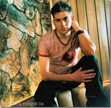  the gay-boy with big brown eyes in a smooth face and dark brown hair 