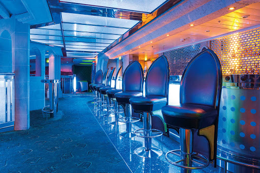 Stop by the Dragon's Lair, a nightclub on deck 3 of Mariner of the Seas, for a late-night drink and dancing.
