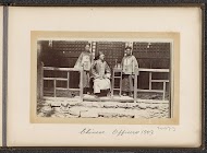 Chinese officers in front of a house in Tibet