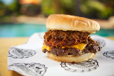 The Chilius Maximus burger served at Guy's Burger Joint on Carnival Cruise Lines.