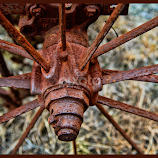 Rusty Wagon Wheel by Judy Rosanno -  