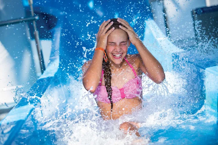 Get a thrill by zipping down the Aqua Park water slide during your Norwegian Cruise Line vacation.
