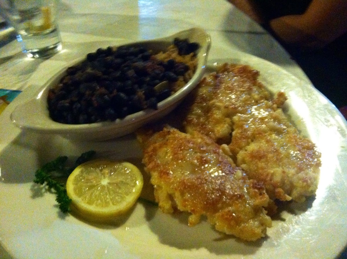 Macadamia crusted yellowtail snapper with black beans and rice.