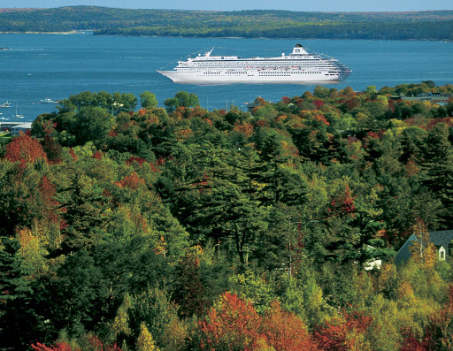 Crystal-Symphony-New-England - Crystal Symphony sails past fall foliage in New England.